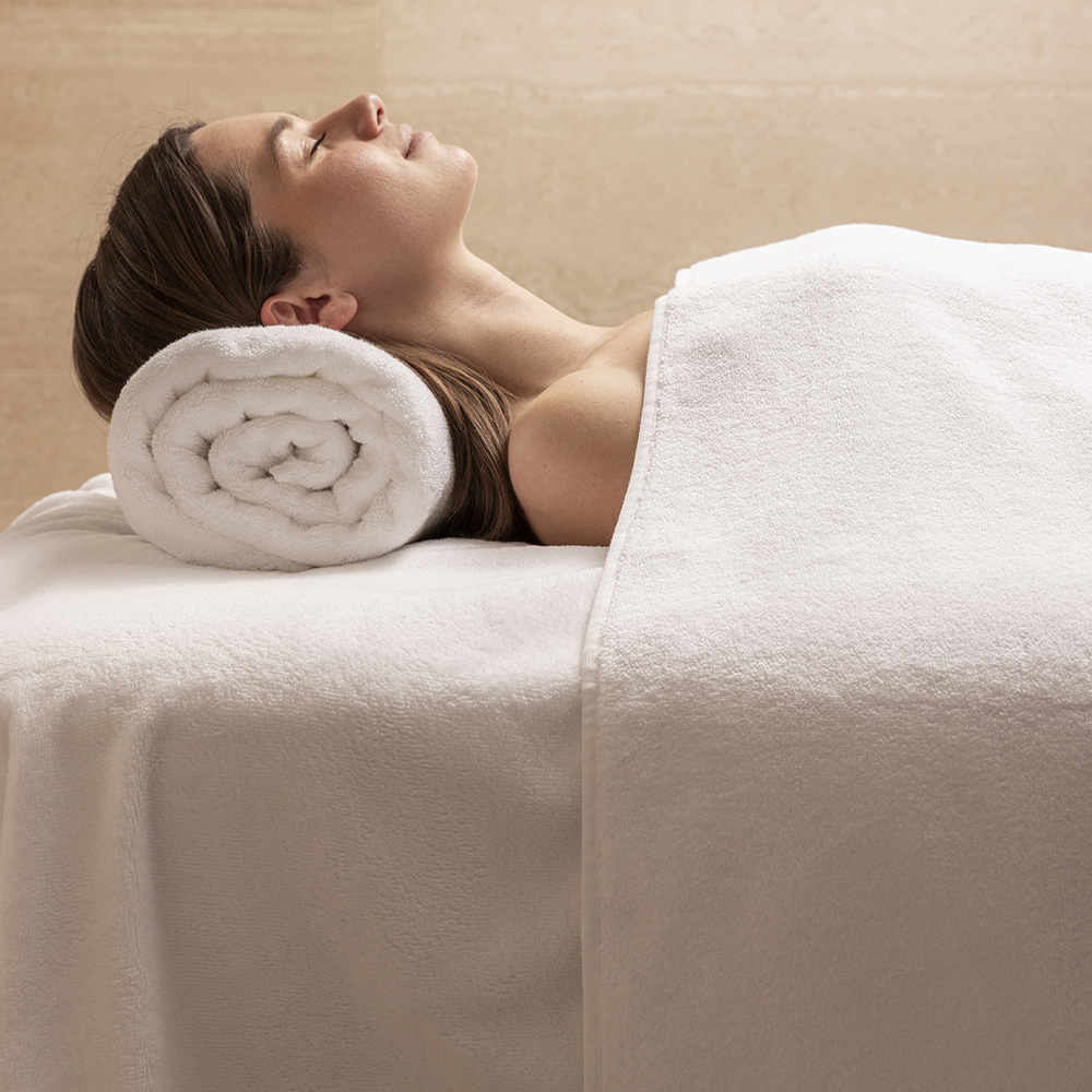Spa treatment with rolled towel