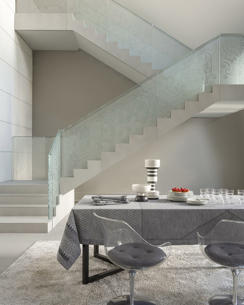Staircase and set table with grey tablecloth